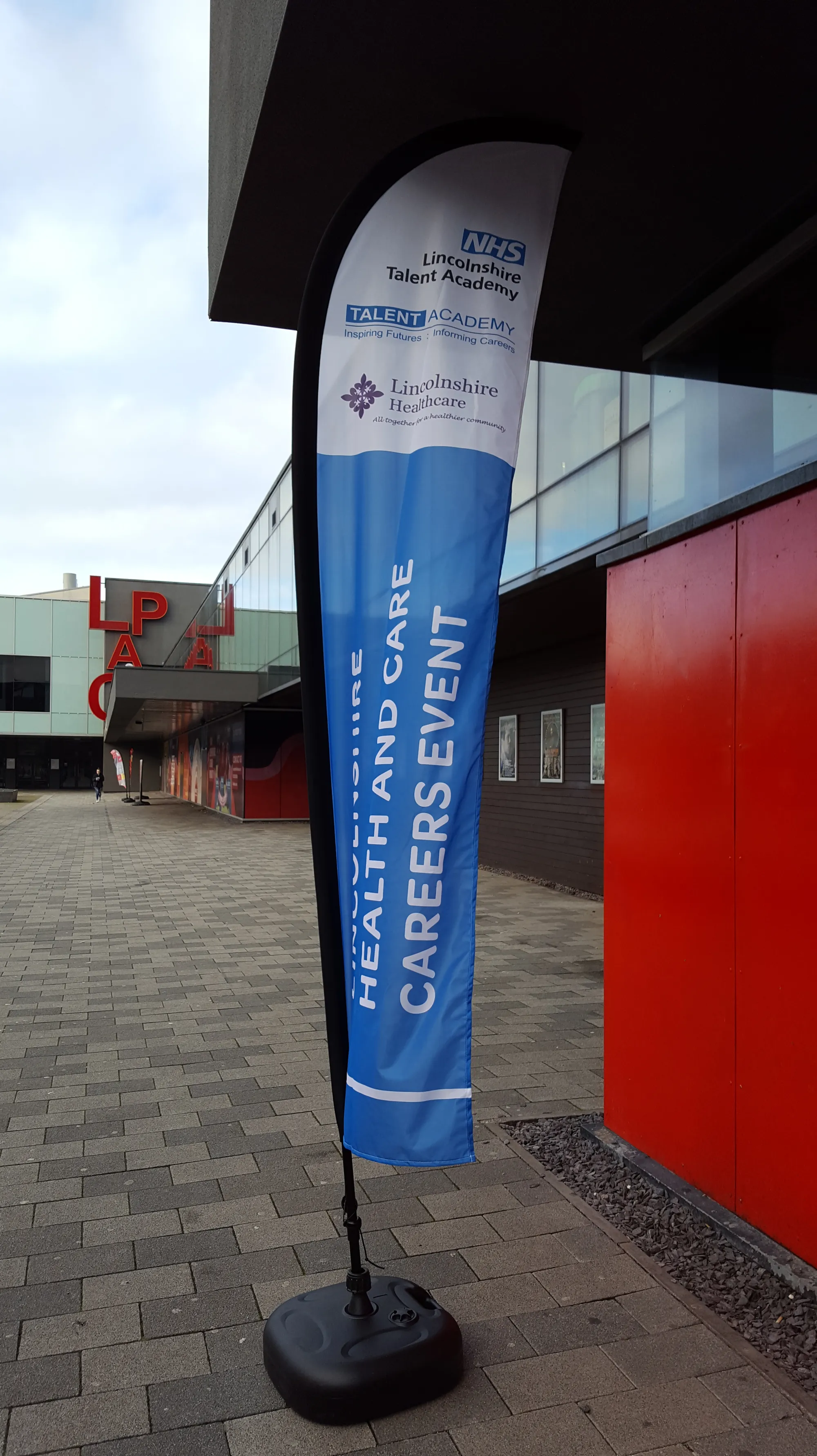 Health and Care Careers Event teardrop banner outside the venue